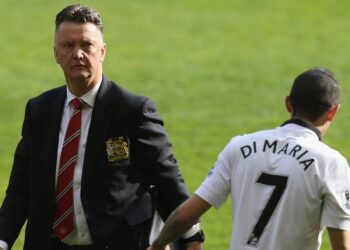 Angel Di Maria shakes manager Luis Van Gaal after a Premier League game