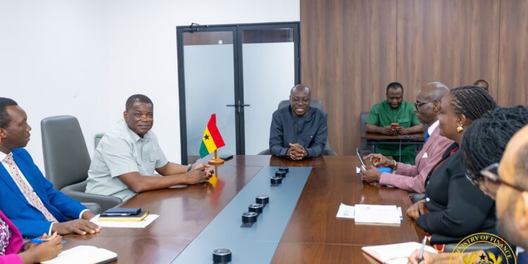 Ghana's Finance Minister Dr Cassiel Ato Forson in discussion with World Health Organization Regional Director for Africa, Dr Mohamed Yakub Janabi