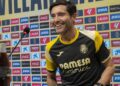 Marcelino smiling as he takes his seat at a pre-match presser