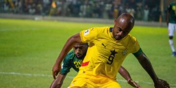Jordan Ayew protects the ball from the Comoros defender in the World Cup qualifier at the Accra Sports Stadium