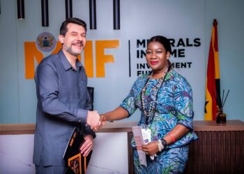 MIIF CEO, Mrs. Justina Nelson with IMF Resident Representative, Dr Adrian Alter