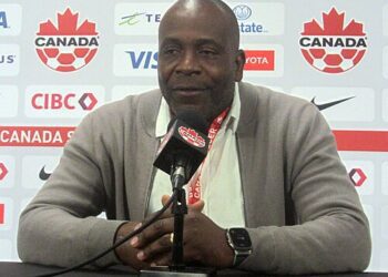 Stanley Purl Menzo speaking at a post-match press conference