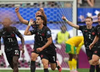 Canada players celebrating after Stephen Eustaquio struck the only goal against South Africa