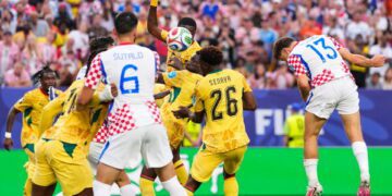 Nikola Vlasic jumps high to head home the corner
