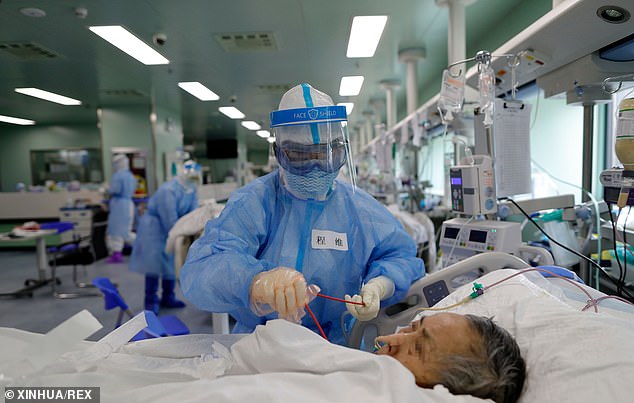 The renowned microbiologist said in June the real COVID-19 infection number in the former virus ground zero Hubei could be 2.2million, or 32 times the government's official toll. 
In this February 21, 2020, photo, patients rest at a temporary hospital at Tazihu Gymnasium in Wuhan
