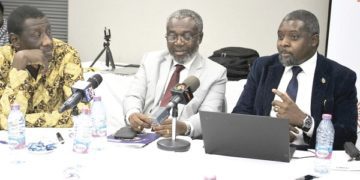 Dr John Amuasi (right). With him are Dr Anthony Nsiah-Asare, The Government Adviser on Health,(middle) and Dr Benjamin Aboagye Marfo