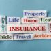 Insurance Companies Urged To Diversify Business Operations To Stay Afloat 11 insurance Word Cloud printed on paper on blue font