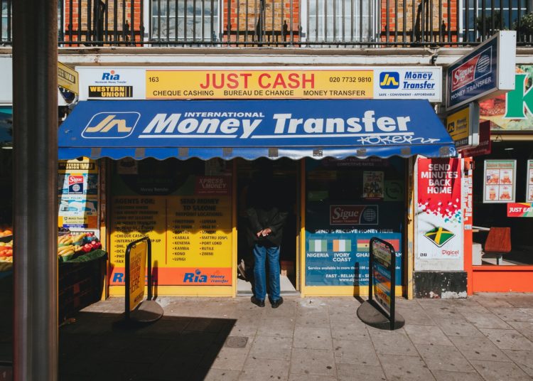 Peckham, London, United Kingdom
Street scene of a man waiting in line at a money transfer shop in London @
Alistair MacRobert