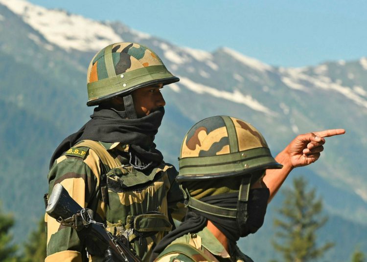 Indian soldiers guard a highway leading towards Leh in Ladakh. Image credit: AFP