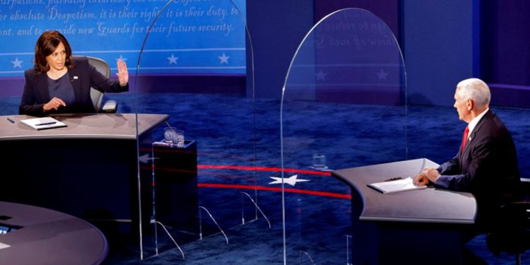 Pence and Harris clash in VP debate 1 Mr Pence and Ms Harris were separated by plexiglass barriers during debate. Image: Reuters