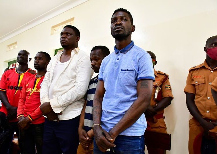 Ugandan presidential candidate Robert Kyagulanyi also known as Bobi Wine stands inside the courtroom in Iganga, eastern Uganda. Image:  REUTERS