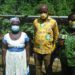 Mrs Amekudzi (Right) with some staff of Mondelez, and a female cocoa farmer