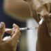 A person is being vaccinated against yellow fever