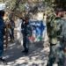 Gunmen storm Kabul University in Afghanistan, killing at least 19 13 A member of security forces stands guard outside Kabul University after the attack. Image: Reuters