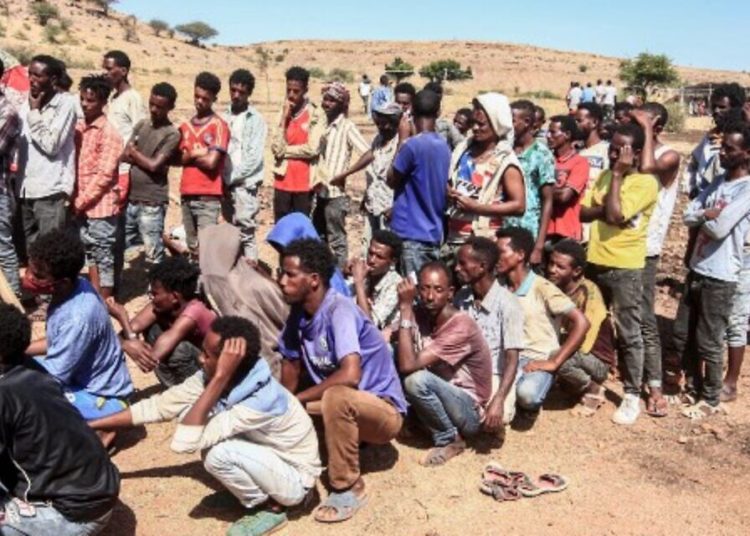 Ethiopian refugees fleeing fighting in Tigray province queue to receive supplies at the Um Rakuba camp in Sudan's eastern Gedaref province, on November 16. Image: AFP