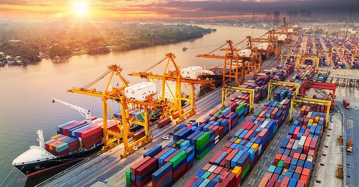 Logistics and transportation of Container Cargo ship and Cargo plane with working crane bridge in shipyard at sunrise, logistic import export and transport industry background