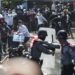 Myanmar police fire warning shots at protesters, dozens arrested