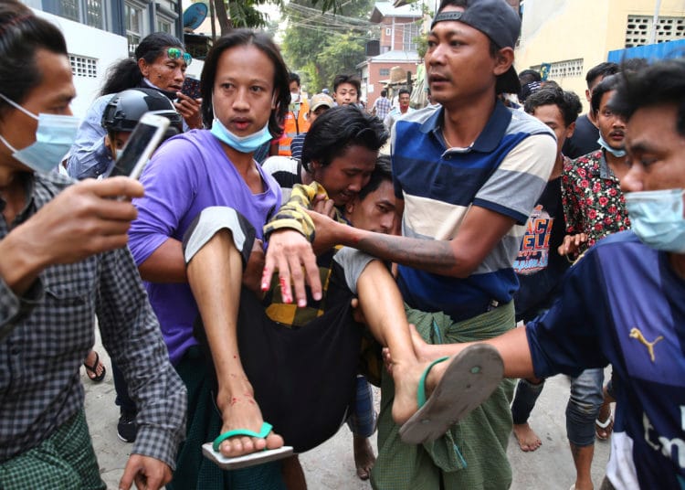 Eleven killed as Myanmar protestors ‘fight soldiers with rifles’