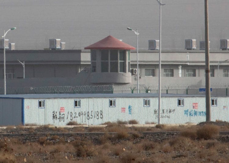 China decries planned UN event on Xinjiang, describes as insult 1 A guard tower and barbed wire fences around a facility in Artux in western China's Xinjiang region