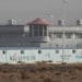 China decries planned UN event on Xinjiang, describes as insult 9 A guard tower and barbed wire fences around a facility in Artux in western China's Xinjiang region