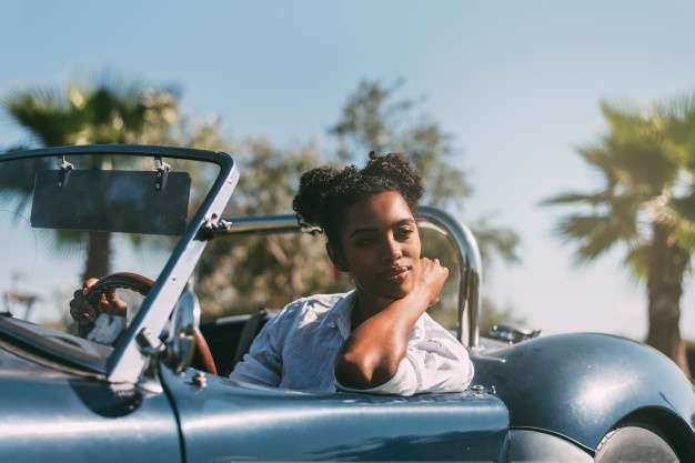 black woman driving vintage convertible car 153437 2071