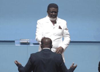 Sam Nartey George receiving prayers from the leader and founder of Perez Chapel, Bishop Charles Agyin-Asare surfaced online.