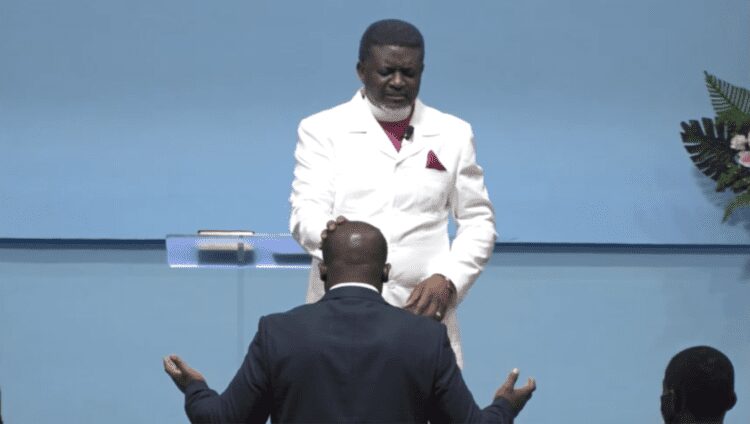 Sam Nartey George receiving prayers from the leader and founder of Perez Chapel, Bishop Charles Agyin-Asare surfaced online.