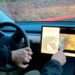 Tesla has agreed to modify a software in its cars that will prevent drivers and passengers from playing video games on the dashboard screens while the vehicle is in motion.