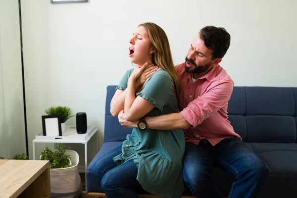 depositphotos 481387678 stock photo stressed latin man doing heimlich