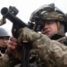 Territorial defence fighters test weapons and ammunition in Kyiv [Mikhail Palinchak/EPA]