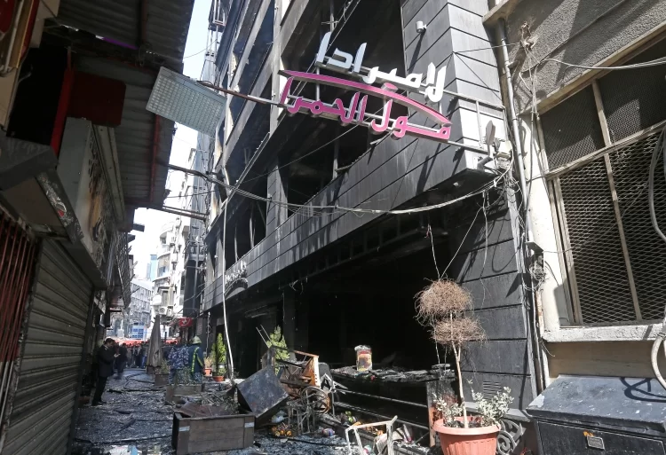 A general view shows the burned La Mirada Mall building following a fire outbreak, in the Syrian capital Damascus, on March 1, 2022 [Louai Beshara/AFP]