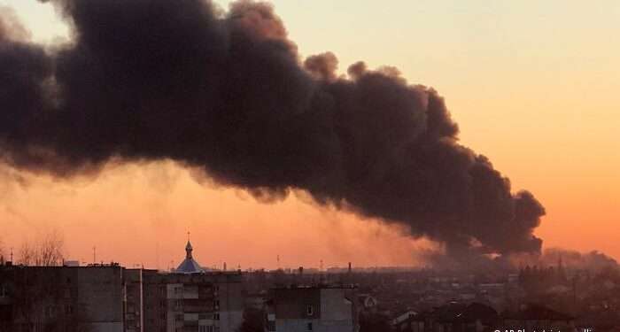 Three loud explosions were heard early on Friday, before a thick plume of black smoke rose above Lviv