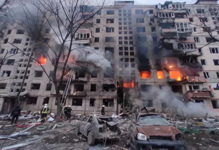 Strikes Hit Residential Building in Kyiv as Russian Forces Edge Closer 1 In this handout picture taken and released by the State Emergency Service of Ukraine on March 14, 2022, firefighters work to extinguish a fire in an apartment building hit by shelling in the Obolon district of Kyiv