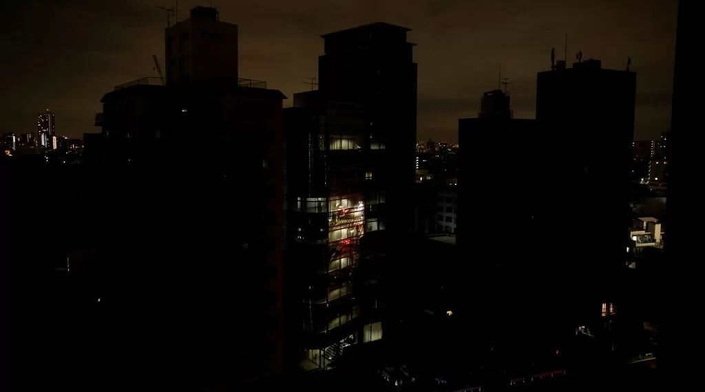 Quake Shakes Eastern Japan, Prompting Tsunami Warning 1 Houses and buildings are seen in an electric stoppage at the area after an earthquake at Toshima ward in Tokyo, Japan March 17, 2022.