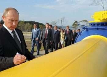 President Vladimir Putin standing by one of Russia's gas pipeline