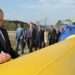 President Vladimir Putin standing by one of Russia's gas pipeline