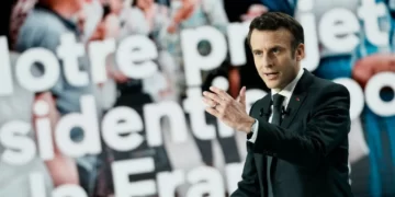 French President Emmanuel Macron at a press conference in Aubervilliers, north of Paris, on March 17, 2022. © Thibault Camus, AP