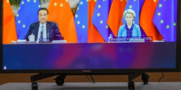 Chinese Premier Li Keqiang and European Commission President Ursula von der Leyen speak via video conference [Olivier Matthys/Pool/AP]