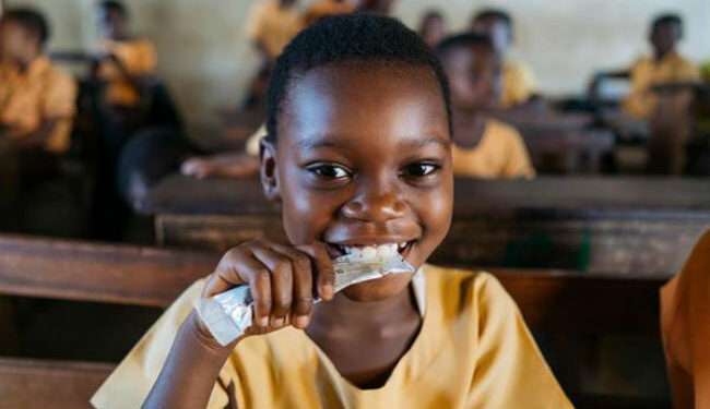 President's Vision Becoming a Reality, School Children to Access Cocoa Beverages in Ghana 1 Happy school child drinking cocoa beverage