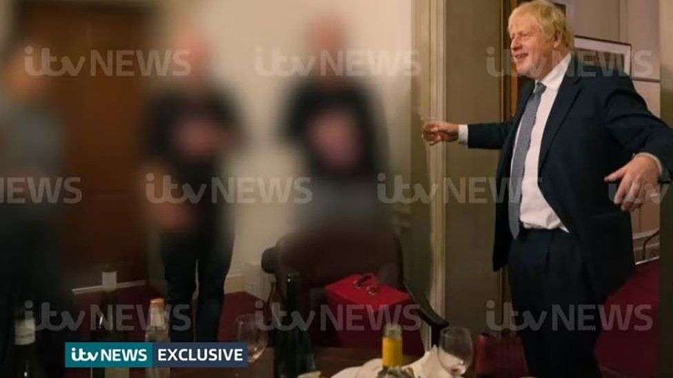 Boris Johnson captured at a party