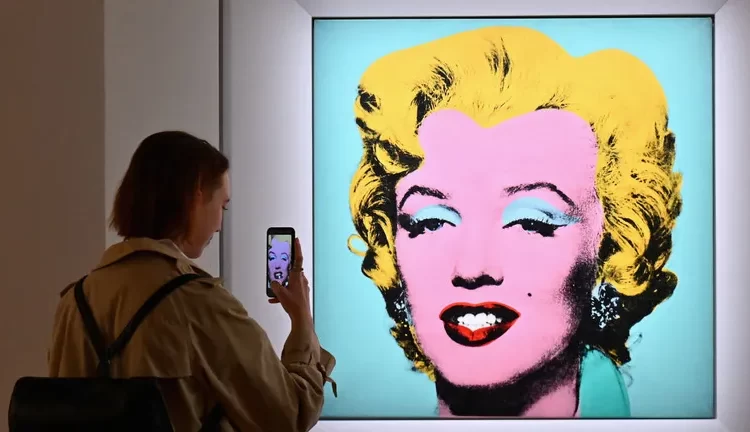 Famous Marilyn Monroe Portrait Sells for Record $195million 1 A famous Andy Warhol silkscreen portrait of Marilyn Monroe, sold for $195 million at a Christie's charity auction, setting a record for the most expensive piece of American art ever sold