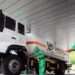 A worker disinfects a vehicle carrying medical oxygen, in Pyongyang