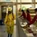 Employees spray disinfectant and wipe surfaces in North Korea's capital, Pyongyang