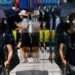 Japan Swelters in Worst Heatwave Since 1875 12 A woman wipes her face as she walks down a street in Tokyo