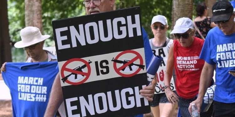 Tens of thousands of protesters rallied across the US on Saturday to call for stricter gun laws