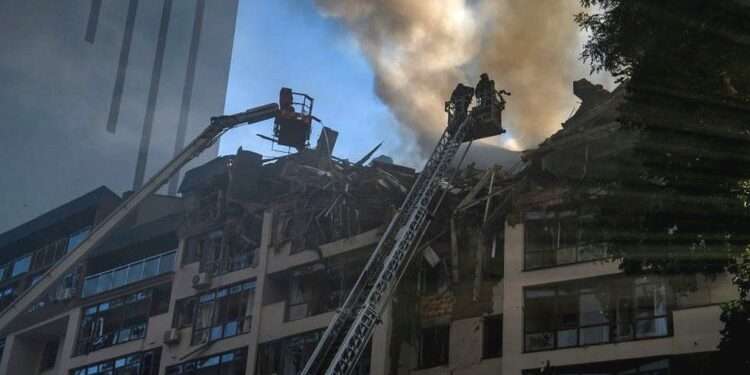 A Russian missile wrecked a nine-storey apartment block in central Kyiv