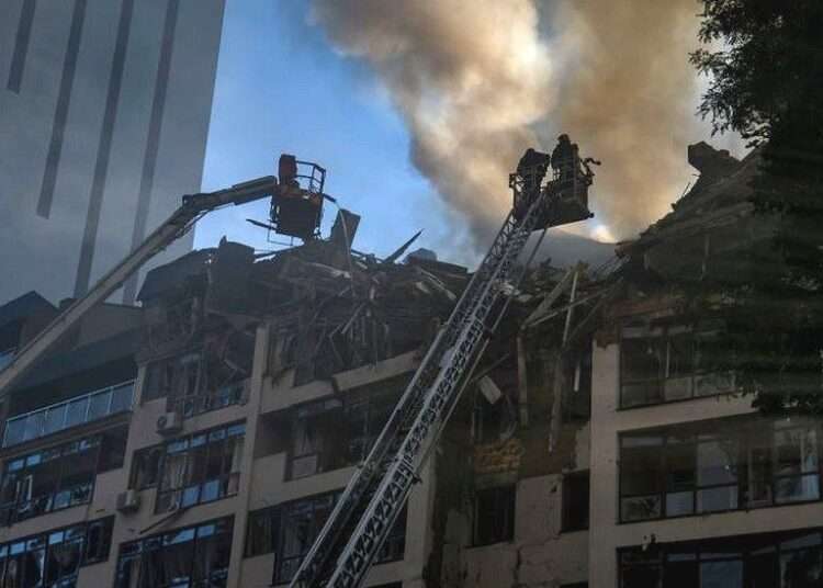 A Russian missile wrecked a nine-storey apartment block in central Kyiv