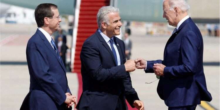 Joe Biden was greeted by Israel's President Isaac Herzog (L) and Prime Minister Yair Lapid (C)
