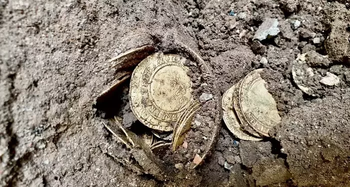 UK: A Kitchen Renovation Leads To The Discovery Of 18th-Century Gold Coins Worth $290,000 1 Part of the coin hoard found under the kitchen of an 18th-century house. Image credit: Spink & Son