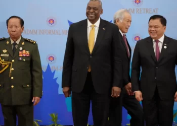 U.S. Secretary of Defense Lloyd J. Austin III, center, poses for a group photo together with Cambodia's Defense Minister Tea Banh.